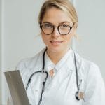 A Doctor Holding a Clipboard