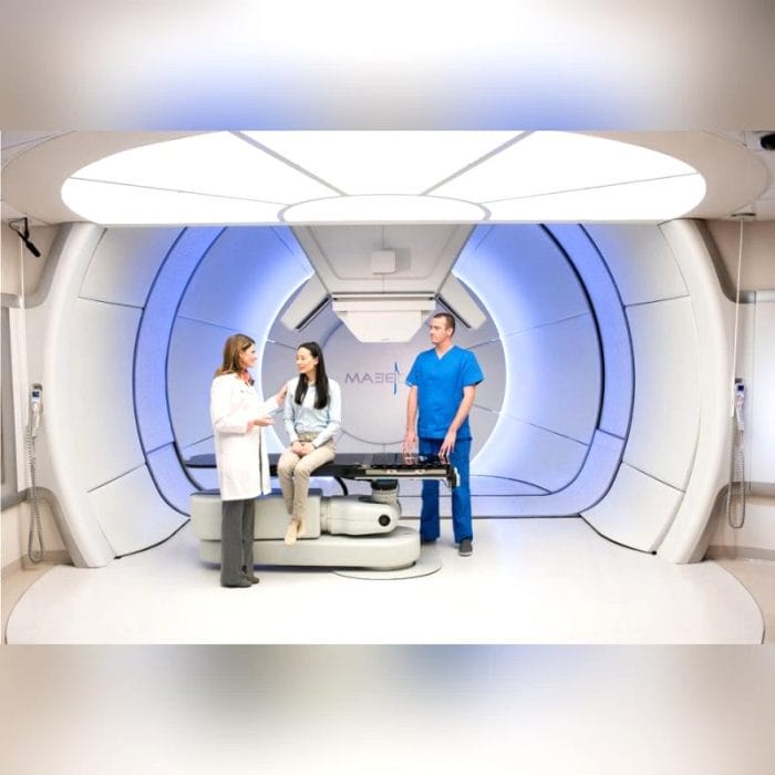 Proton Therapy Cyclotron With Robotized Positioning Table