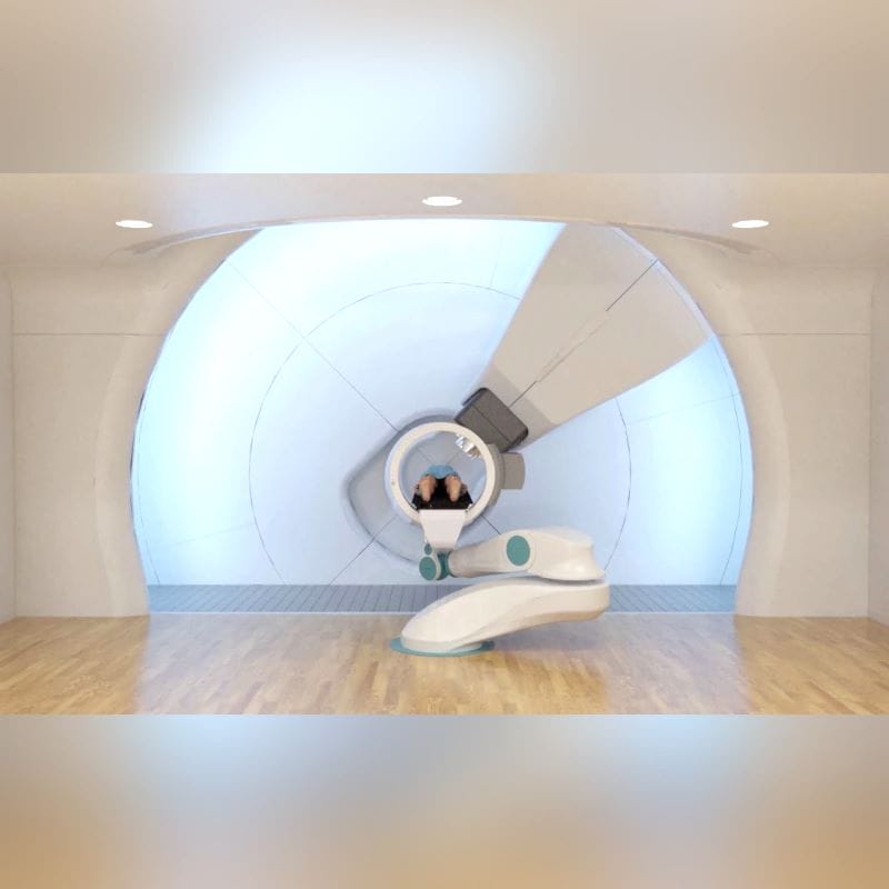 Proton Therapy Cyclotron With Robotized Positioning Table