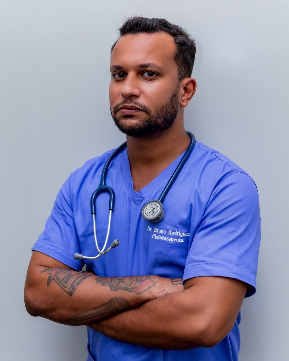 man in blue crew neck t-shirt wearing blue stethoscope